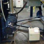 Helium leak testing a kinney vacuum pump